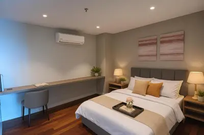 a hotel room with a bed and a desk at Novo Ampang by Dormeo Destinations - Near KLCC and TRX in Kuala Lumpur