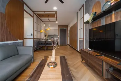 a living room with a couch and a tv at Ancestry 3BR M Vertica MRT Access by RumaBnB in Kuala Lumpur