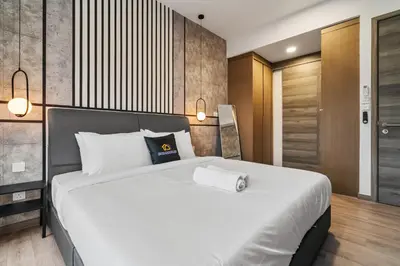 a bedroom with a large white bed in a room at Prestige 2BR Agile BB WiFi Netflix in Kuala Lumpur
