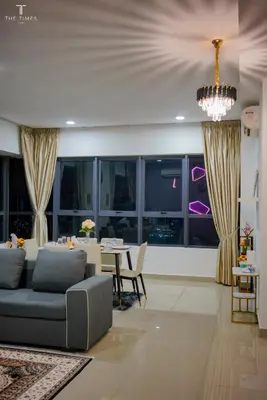 a living room with a couch and a table at Arte Plus Luxury Suites with KLCC View in Kuala Lumpur