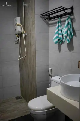 a bathroom with a toilet and a sink at Arte Plus Luxury Suites with KLCC View in Kuala Lumpur