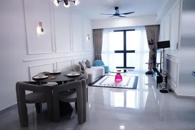 a living room with a table and a couch at Agile Residence Bukit Bintang by Luma in Kuala Lumpur