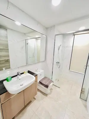 a bathroom with a sink and a shower and a toilet at Agile Residence Bukit Bintang by Luma in Kuala Lumpur