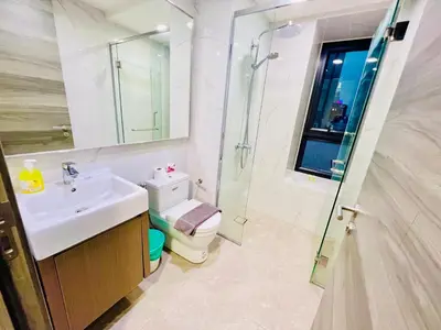 a bathroom with a toilet and a sink and a shower at Agile Residence Bukit Bintang by Luma in Kuala Lumpur