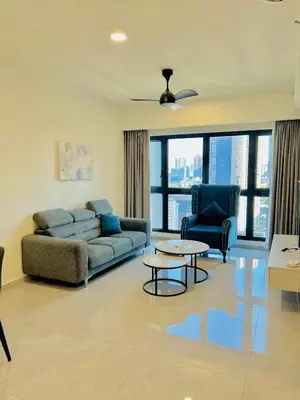 a living room with a couch and a table and chairs at Agile Residence Bukit Bintang by Luma in Kuala Lumpur