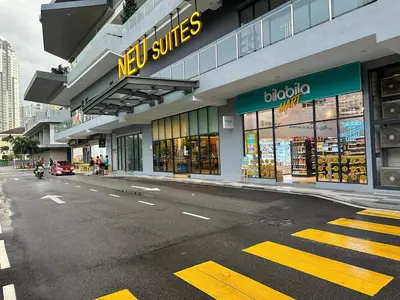 a store on the side of a city street at Neu Suites Apartments by LammyNora in Kuala Lumpur