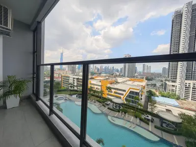 a balcony with a view of a city at TRION The 108 Family Suite Pool & City view in Kuala Lumpur