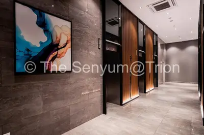 a hallway in a building with a painting on the wall at TRION The 108 Family Suite Pool & City view in Kuala Lumpur