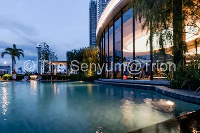 a large swimming pool in front of a building at TRION The 108 Family Suite Pool & City view in Kuala Lumpur