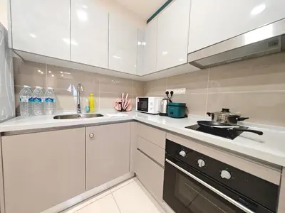 a kitchen with white cabinets and a sink at TRION 2BR 6pax Ikea BBCC TRX Velocity KL Base 3KM in Kuala Lumpur