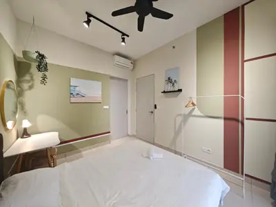 a bedroom with a white bed and a ceiling fan at TRION 2BR 6pax Ikea BBCC TRX Velocity KL Base 3KM in Kuala Lumpur