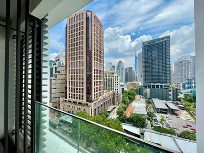 a view of a city skyline from a balcony at Quill Comport Suits KLCC in Kuala Lumpur