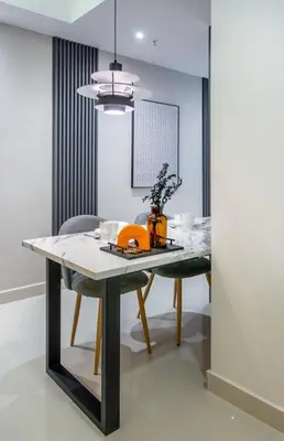 a dining room with a table and a chair at NOVO Ampang Stylish Studio & 1BR with Infinity Pool near KLCC & Gleneagles in Kuala Lumpur