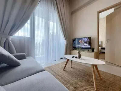 a living room with a couch and a table at The Colony By Infinitum P in Kuala Lumpur