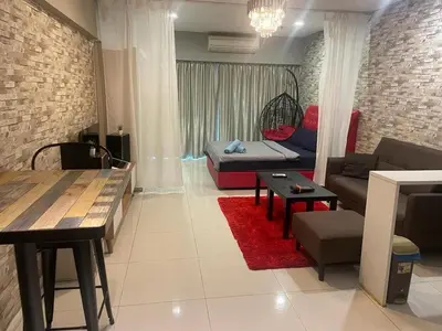 a living room with a couch and a table at summer suites studios in Kuala Lumpur