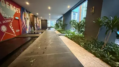 an empty hallway with plants in a building at Star Residences KLCC by Nexus 62 in Kuala Lumpur