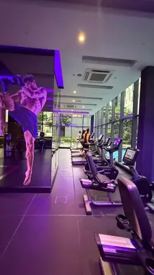 a man doing a jump in a gym at Star Residences KLCC by Nexus 62 in Kuala Lumpur
