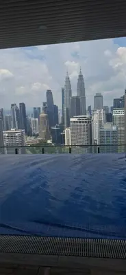 a view of a city skyline from the top of a building at THE COLONY BY INFINITUM by ZENTRIP in Kuala Lumpur