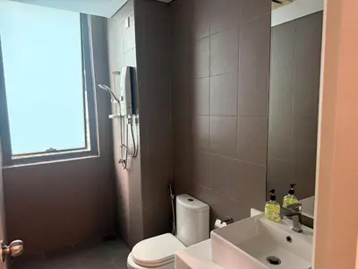 a bathroom with a toilet and a sink at Summer popular suites kl Bukit Bintang in Kuala Lumpur