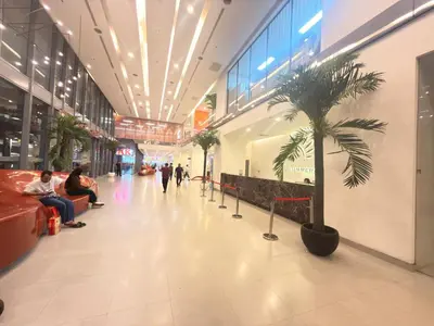 a mall with a palm tree in the middle at Summer popular suites kl Bukit Bintang in Kuala Lumpur
