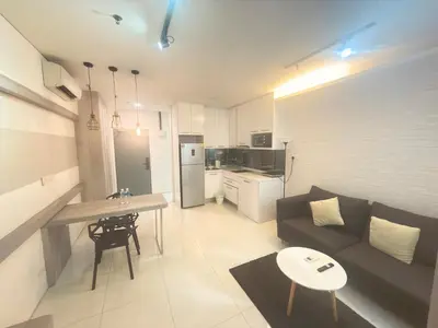 a living room with a couch and a table at Summer popular suites kl Bukit Bintang in Kuala Lumpur