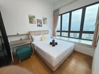 a bedroom with a bed and a large window at Lucky Suites KLCC By LUXE Infinitum in Kuala Lumpur