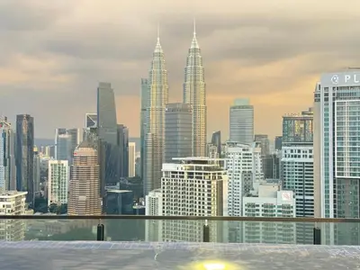 a view of a city skyline with tall buildings at Lucky Suites KLCC By LUXE Infinitum in Kuala Lumpur