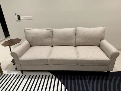 a couch sitting in a living room at Alaxis Suite Home By Residensi Brickfields in Kuala Lumpur