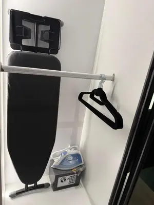 a black snowboard and a scale on a wall at Alaxis Suite Home By Residensi Brickfields in Kuala Lumpur