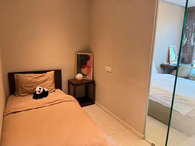 a bedroom with a panda bear on a bed at Dorsett Hartamas, KL City, Bathtub, Rooftop Pool in Kuala Lumpur