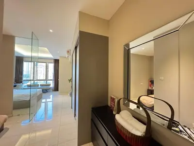 a room with a mirror and a living room at Dorsett Hartamas, KL City, Bathtub, Rooftop Pool in Kuala Lumpur