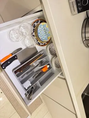 a drawer in a cabinet filled with kitchen utensils at Dorsett Hartamas, KL City, Bathtub, Rooftop Pool in Kuala Lumpur