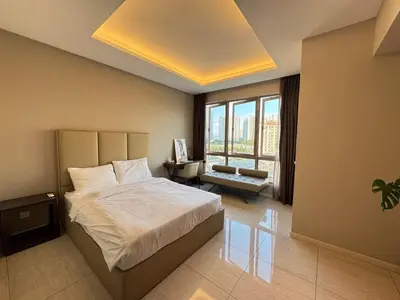 a bedroom with a bed and a large window at Dorsett Hartamas, KL City, Bathtub, Rooftop Pool in Kuala Lumpur