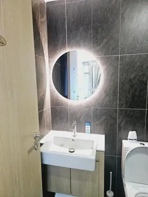 a bathroom with a sink and a mirror at Colony Infinitum KualaLumpur by FR in Kuala Lumpur