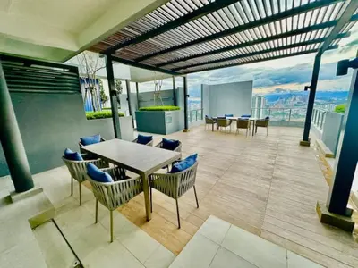 a room with a table and chairs on a building at Neu Suites #2BR Apartment by LammyNora in Kuala Lumpur