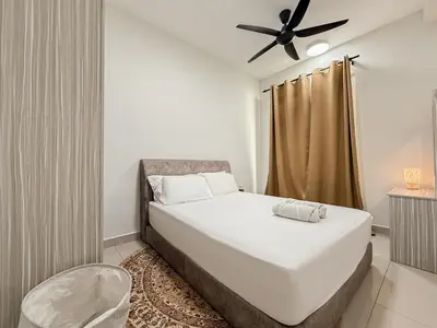 a bedroom with a bed with a ceiling fan at Mountain City View 3BR Condo with Swimming Pool & Free WiFi Netflix in Kuala Lumpur