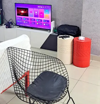 a chair sitting in front of a computer screen at Arte Plus KLCC Family Studio Apartment Kuala Lumpur in Kuala Lumpur