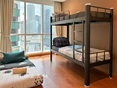 two bunk beds in a room with a large window at 2BR3B Hozem KL1602 Apartment KLCC in Kuala Lumpur