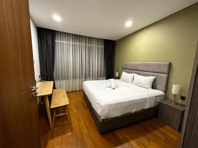a hotel room with a bed and a window at Vortex suites Klcc by stuning vibes in Kuala Lumpur