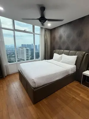 a large bed in a room with a large window at Vortex suites Klcc by stuning vibes in Kuala Lumpur