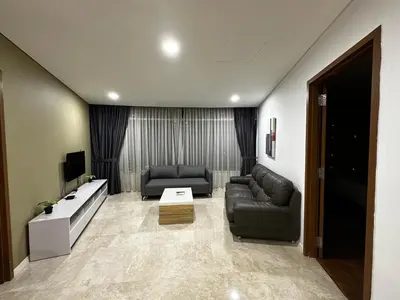 a living room with two couches and a tv at Vortex suites Klcc by stuning vibes in Kuala Lumpur
