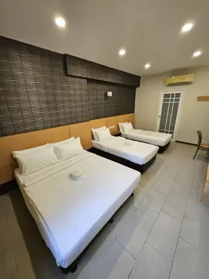 a room with two beds in a room at Swing & Pillows - Imbi Bukit Bintang in Kuala Lumpur