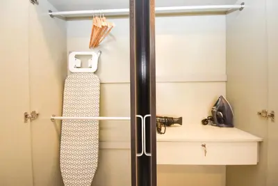 a skateboard is sitting on a shelf in a closet at Trion KL by CityNest in Kuala Lumpur