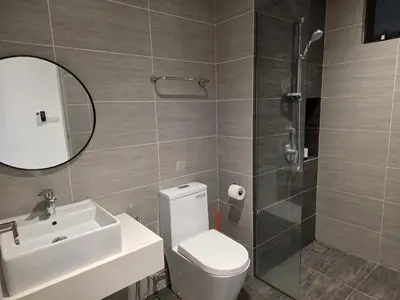 a bathroom with a toilet and a sink and a shower at Trion KL by CityNest in Kuala Lumpur