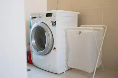 a washing machine sitting in a room with at NEW 2BR KL Gateway LRT Midvalley and KLCC, KL Sentral in Kuala Lumpur