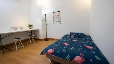 a bedroom with a bed with pink flamingos on it at NEW 2BR KL Gateway LRT Midvalley and KLCC, KL Sentral in Kuala Lumpur
