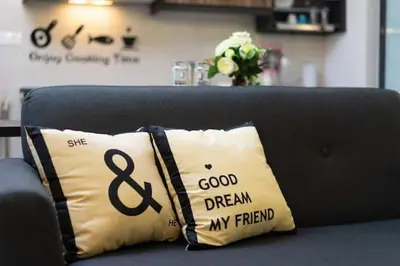 a pillow sitting on top of a couch at NEW 2BR KL Gateway LRT Midvalley and KLCC, KL Sentral in Kuala Lumpur