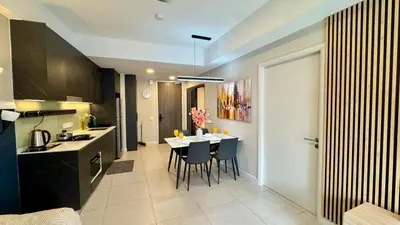 a kitchen and dining room with a table and chairs at Warm & Cozy 2Bedroom Apartment at The Atrium Ampang by OKBnB in Kuala Lumpur