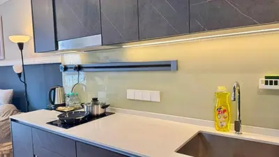 a kitchen with a sink and a counter top at Warm & Cozy 2Bedroom Apartment at The Atrium Ampang by OKBnB in Kuala Lumpur