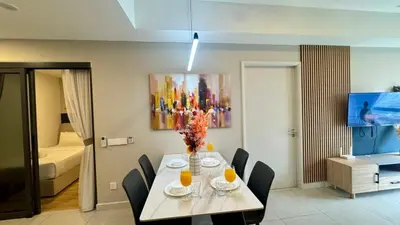 a dining room with a table and chairs in a room at Warm & Cozy 2Bedroom Apartment at The Atrium Ampang by OKBnB in Kuala Lumpur